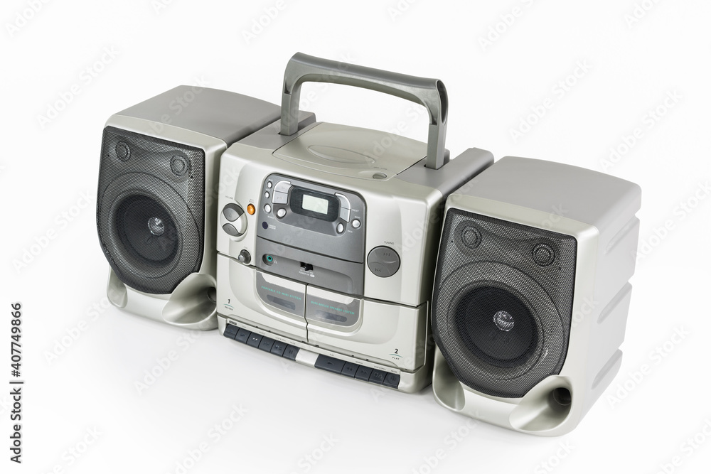 Old stereo boom box portable radio, cd, cassette tape player and recorder machine on white. Old stereo boom box portable radio, cd, cassette tape player and recorder machine on white.