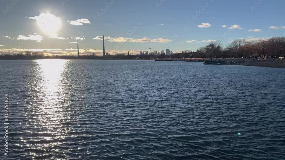 The Toronto skyline is seen from the Beaches neighbourhood along the shores of Lake Ontario in this slow motion shot. The Toronto skyline is seen from the Beaches neighbourhood along the shores of Lake Ontario in this slow motion shot.