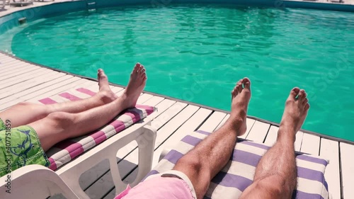 Young men chilling on the sun lounger