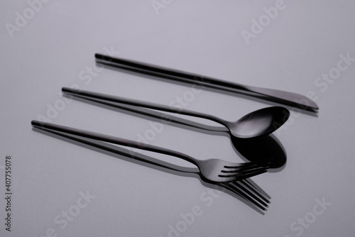 Cutlery on a gray background with shadow. Table serving