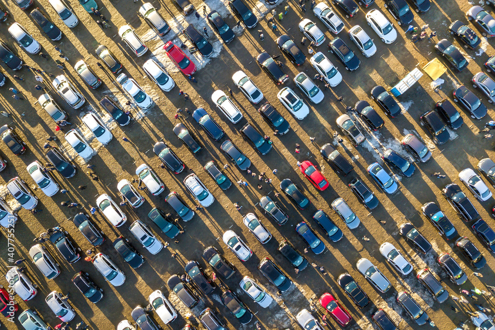 Aerial drone image of many cars parked on parking lot, top view.