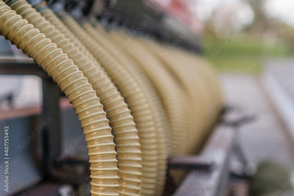 Close up of row of industrial hoses Close up of row of industrial hoses