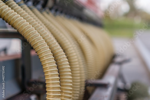 Close up of row of industrial hoses