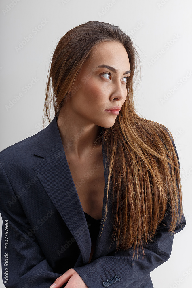 portrait of young attractive asian woman with long hair in blue suit isolated on white background. skinny stylish pretty female posing at studio. model tests of beautiful lady portrait of young attractive asian woman with long hair in blue suit isolated on white background. skinny stylish pretty female posing at studio. model tests of beautiful lady