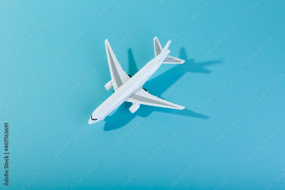 toy airplane on blue background top view with space for text toy airplane on blue background top view with space for text