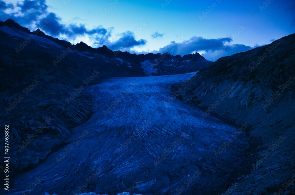  fantastic view of the great rhone glacier by night and the mountains in the canton of valais. Eternal ice near the Furka Pass, Switzerland. Viewpoint