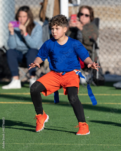 Young boy playing flag football
