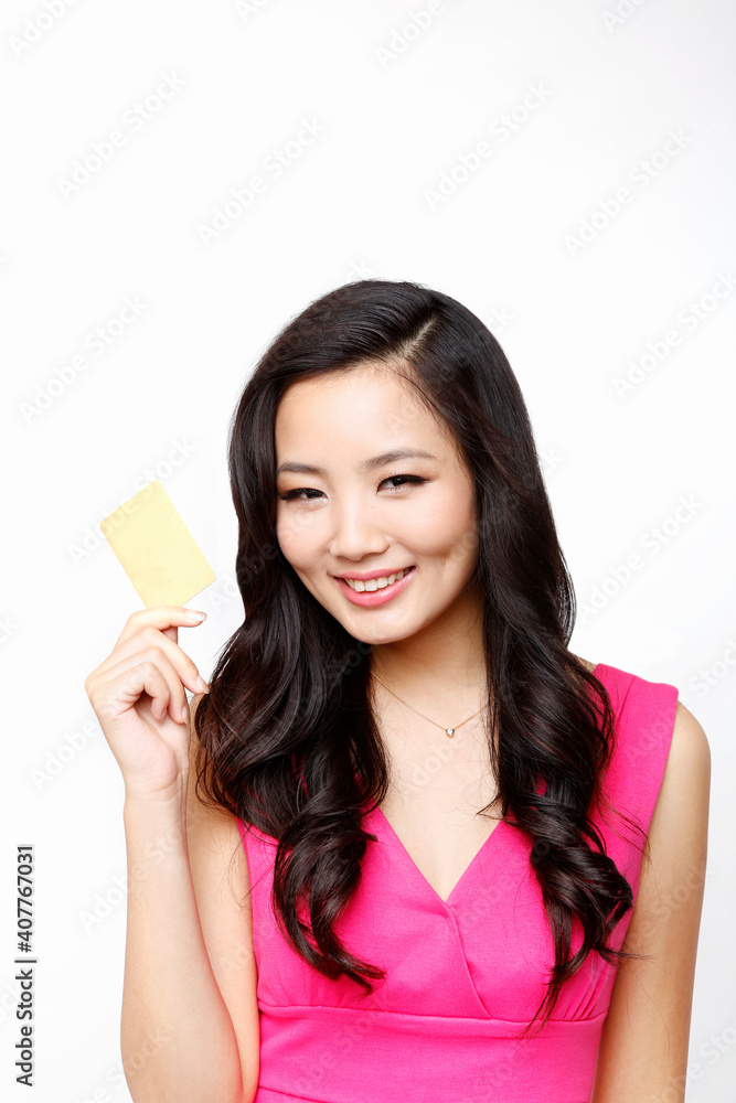 Fashion young woman holding a credit card Fashion young woman holding a credit card