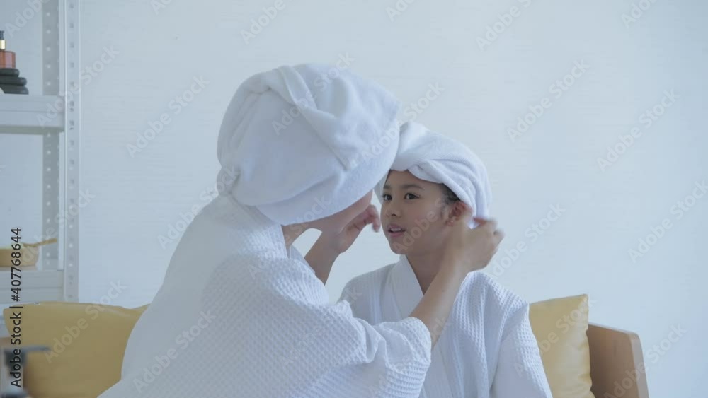 Spa concept of 4k Resolution. The mother is dressing up for her daughter in the room. Spa concept of 4k Resolution. The mother is dressing up for her daughter in the room.
