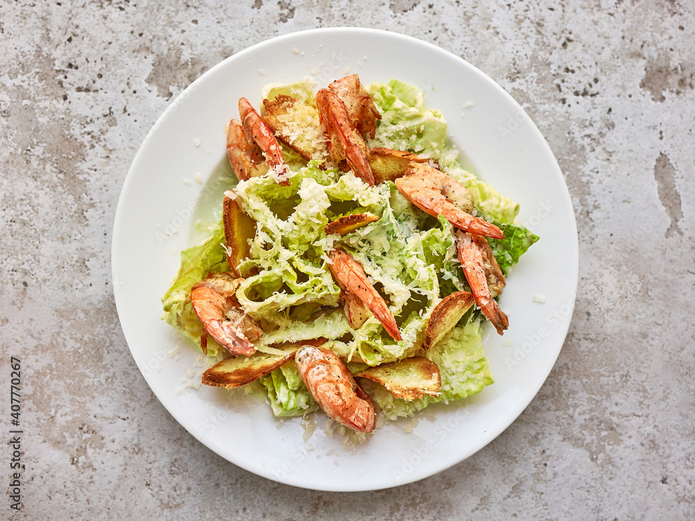 portion of cesar salad with grilled prawns portion of cesar salad with grilled prawns