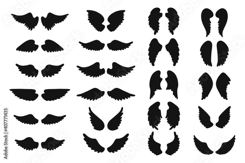 Set of hand drawn angel or bird wings silhouettes. Monochrome drawing elements. 