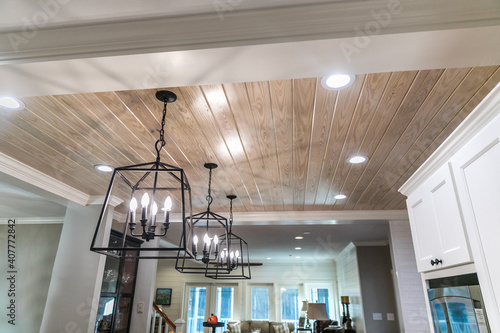 Hanging black metal iron lighting fixtures in a newly renovated kitchen
