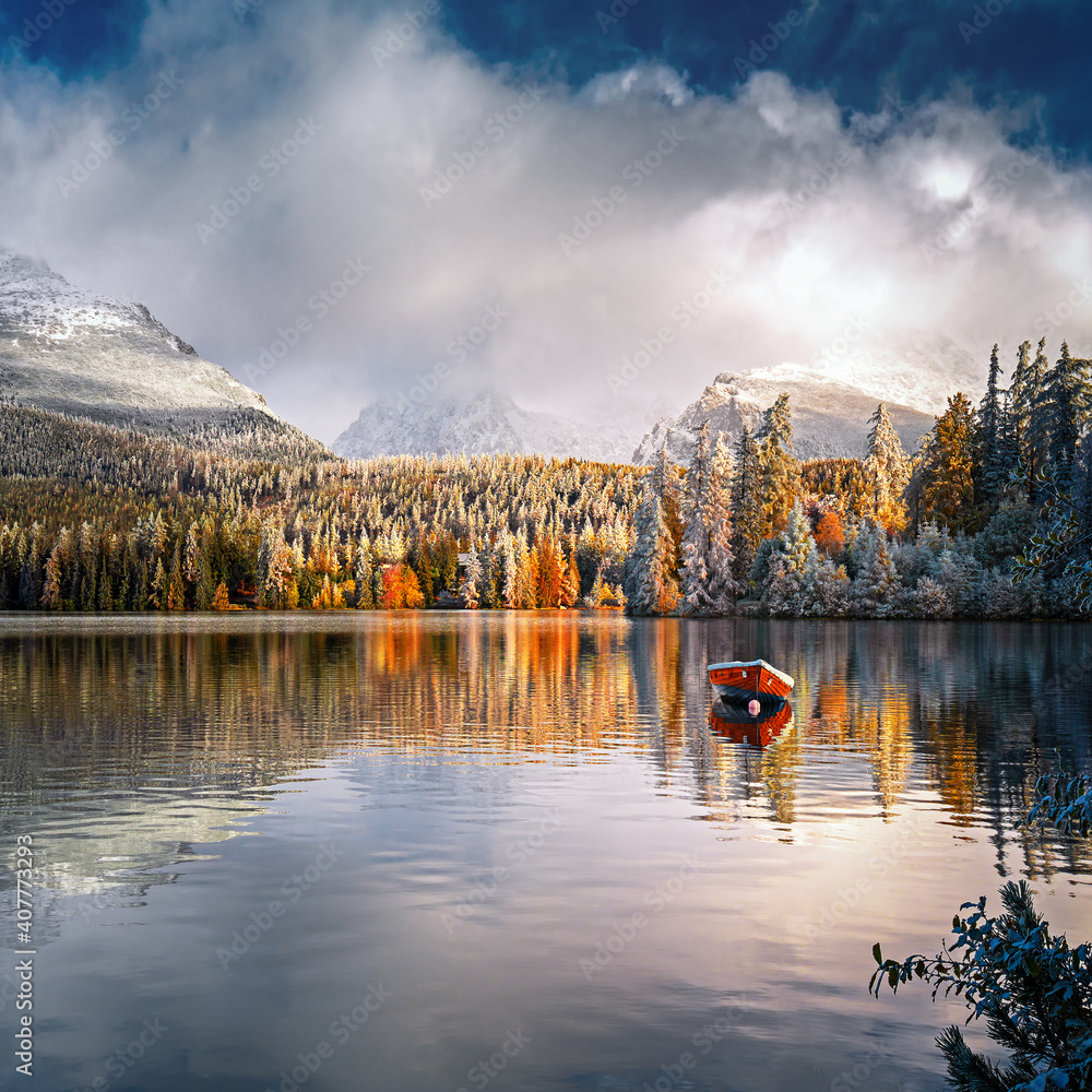 Mountain lake Strbske pleso in National Park High Tatras at sunset, Slovakia, Europe, a boat