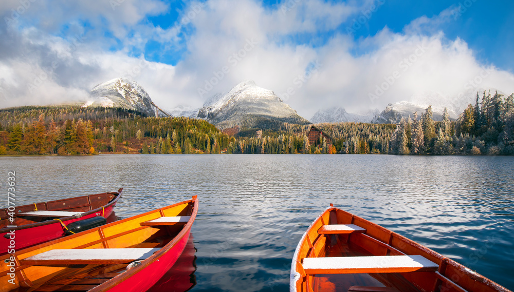 Mountain lake Strbske pleso in National Park High Tatras at sunset, Slovakia, Europe, a boat