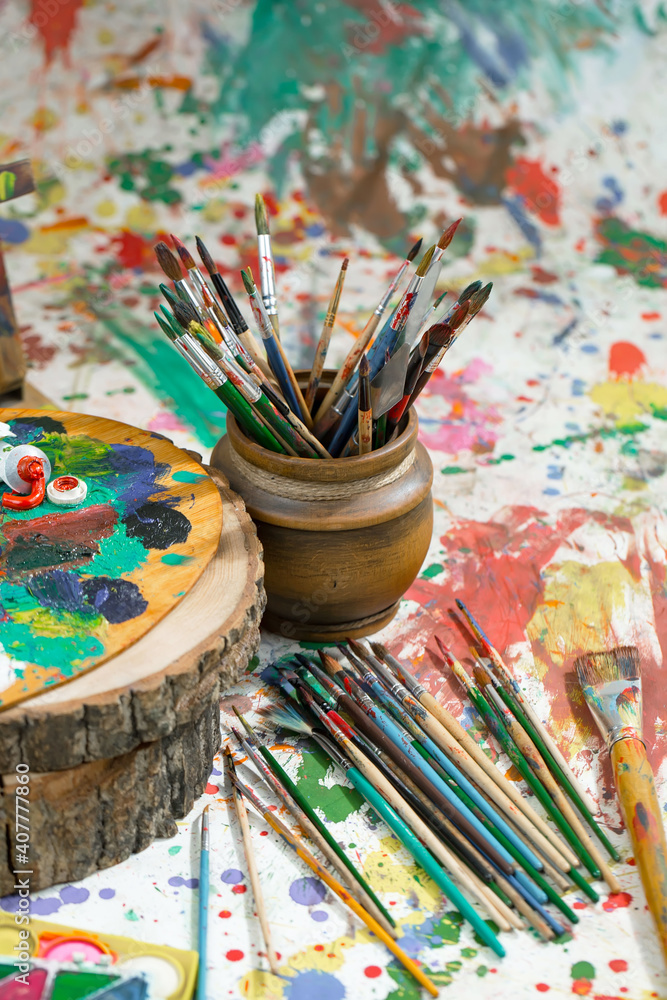 Brushes and paints for painting on an old background. Brushes and paints for painting on an old background.