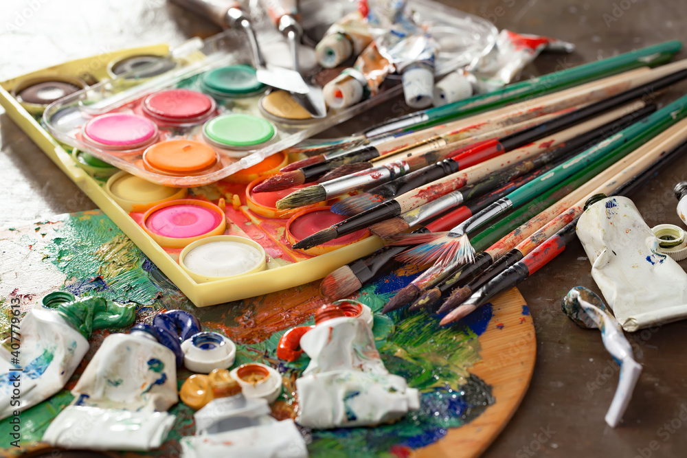 Brushes and paints for painting on an old background. Brushes and paints for painting on an old background.