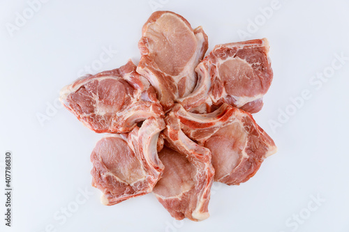 Raw pork chops bone in isoladet on white background. photo