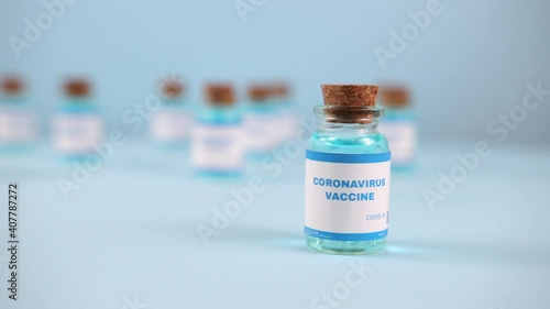 New vaccine pfizer and biontech isolated on blue background. Covid-19, 2019-ncov pandemic. Coronavirus inoculation concept. Sars-cov-2. Ready-made preparations with doses photo