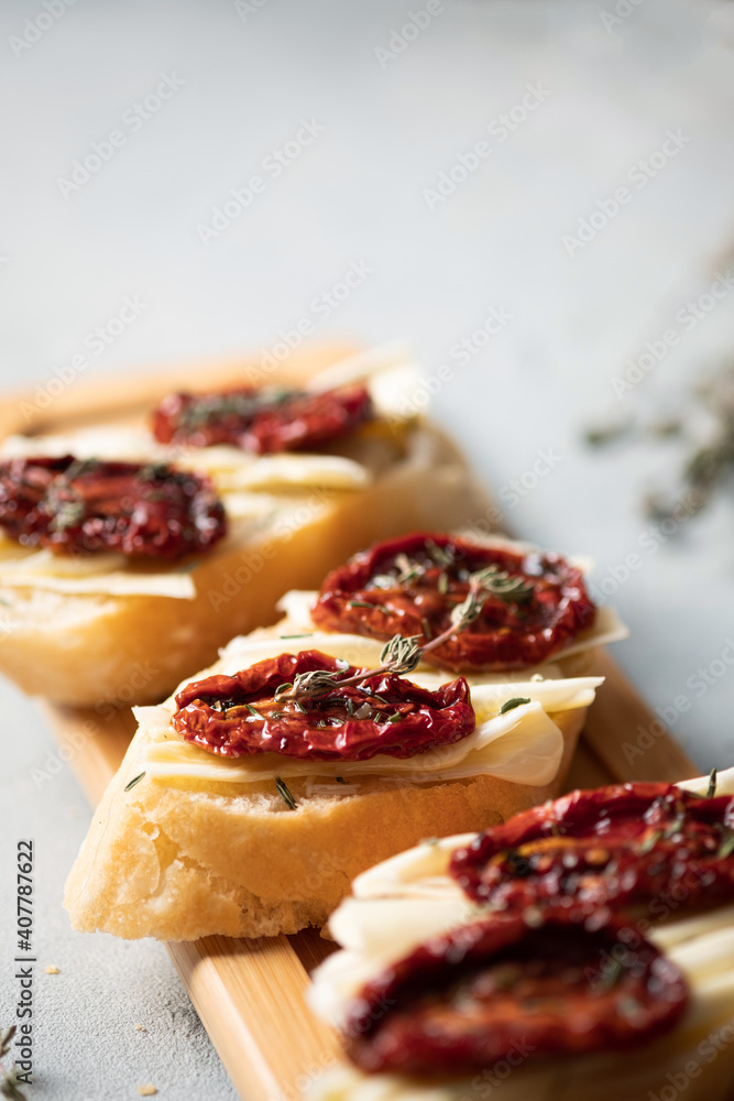Sandwich with sun-dried tomatoes.Italian bruschetta.Delicious dried tomatoes. Sandwich with sun-dried tomatoes.Italian bruschetta.Delicious dried tomatoes.