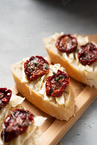 Variety of mini sandwiches with butter and tomatoes