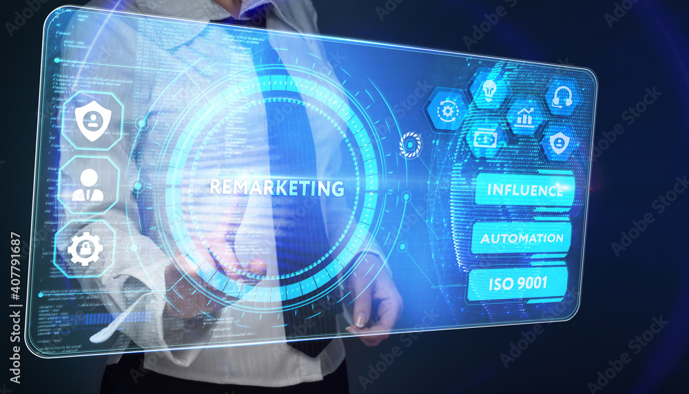 The concept of business, technology, the Internet and the network. A young entrepreneur working on a virtual screen of the future and sees the inscription: Remarketing The concept of business, technology, the Internet and the network. A young entrepreneur working on a virtual screen of the future and sees the inscription: Remarketing