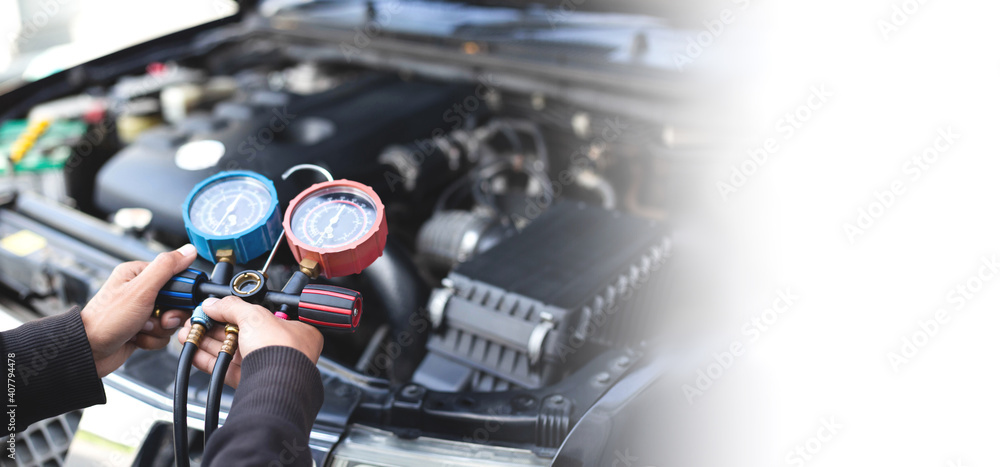 Obraz premium Car air conditioner check service, leak detection, fill refrigerant.Device and meter liquid cooling in the car by specialist technicians.