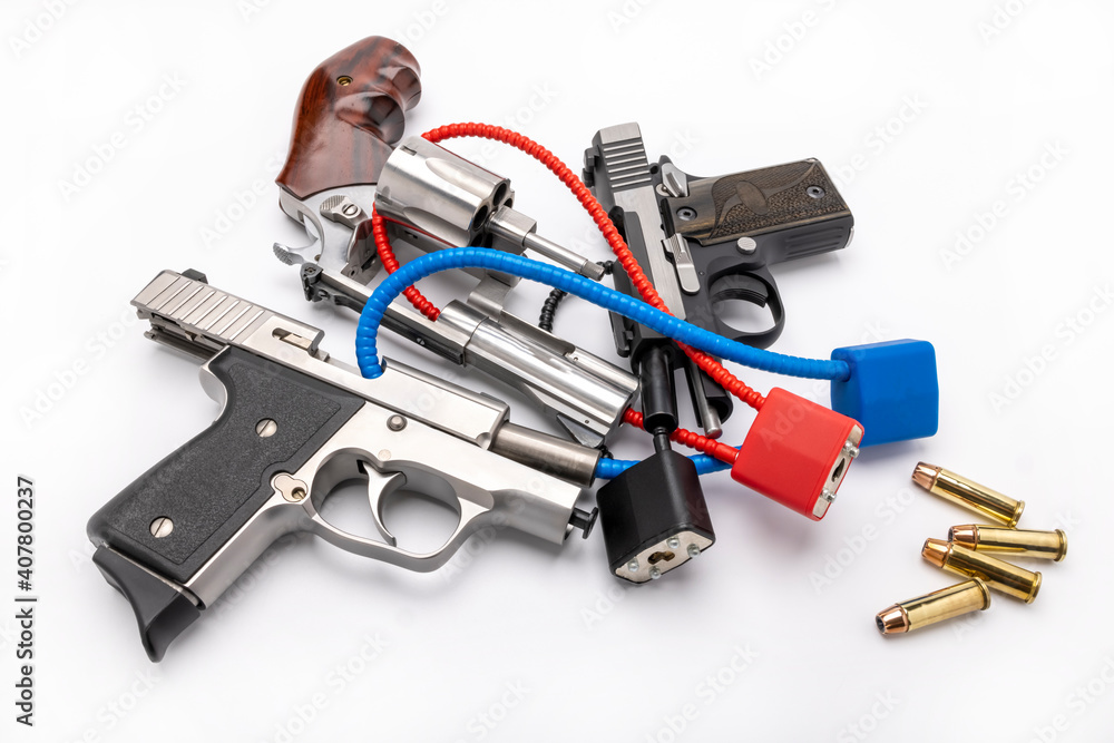 Locked disarmed and secured automatic guns and revolver pistol on white background , Gun safety concept