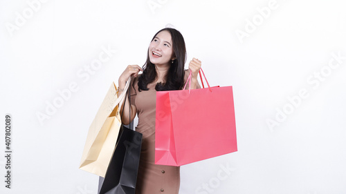 cheerful asian woman shopping isolated white background