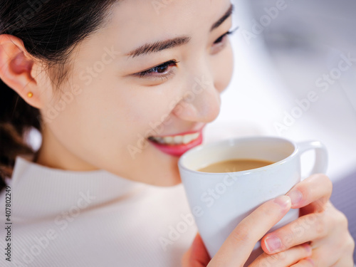 Young women drink coffee