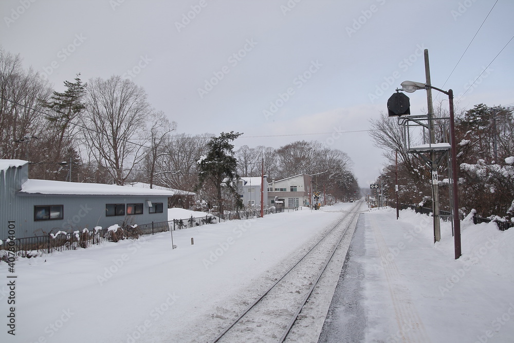 the winter train station with snow landscape in Hokkaido, Japan