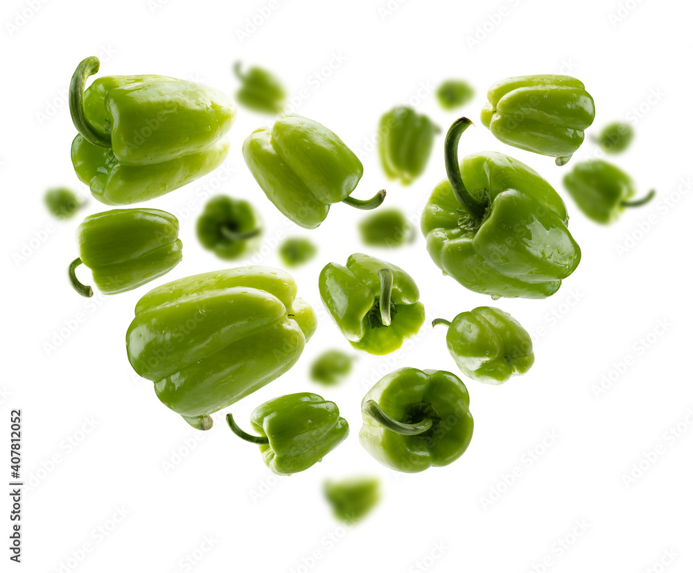 Green paprika in the shape of a heart on a white background Green paprika in the shape of a heart on a white background