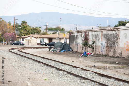 Photography Santa Ana, California, USA - January 10, 2021: Homeless tents sit alongside an abandoned rail road in Santa Ana