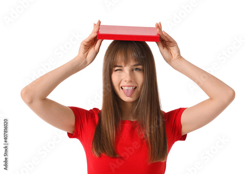 Funny young woman with book...