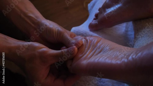 Classic massage of female feet. Treatment in the spa salon. Video of Thai foot massage. The hands of a professional masseur at work.