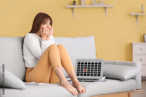 Stressed young woman trying...