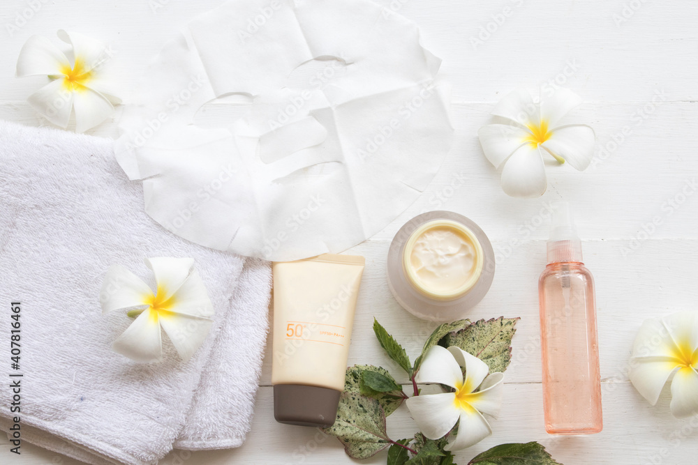 natural cream ,sunscreen spf50 ,sheet mask ,towel and water spray for beauty skin face health care of woman arrangement flat lay style on background white natural cream ,sunscreen spf50 ,sheet mask ,towel and water spray for beauty skin face health care of woman arrangement flat lay style on background white