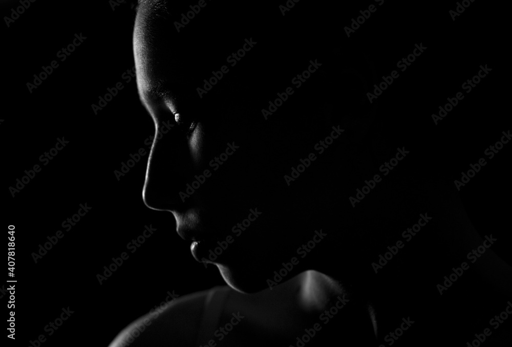 Fototapeta premium Portrait of a girl in a low key