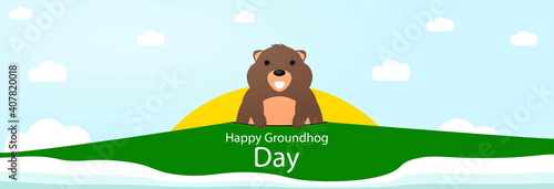 Happy Groundhog Day. Marmot looks out of a burrow on a background of nature.