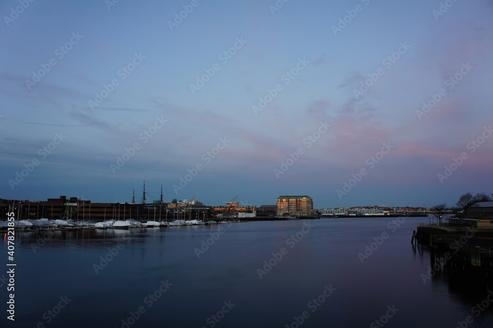 Ocean, ship, port and Boston cityscape