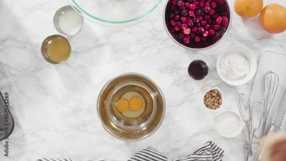 Flat lay. Step by step. Mixing ingredients in a mixing bowl to bake cranberry muffins. Flat lay. Step by step. Mixing ingredients in a mixing bowl to bake cranberry muffins.