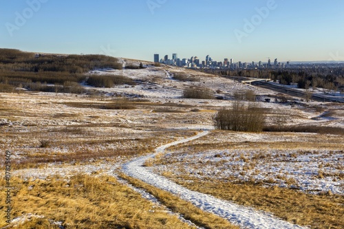 City of Calgary Skyline and Nose Hill Urban Park Landscape on a cold but sunny winter day in Alberta, Canada