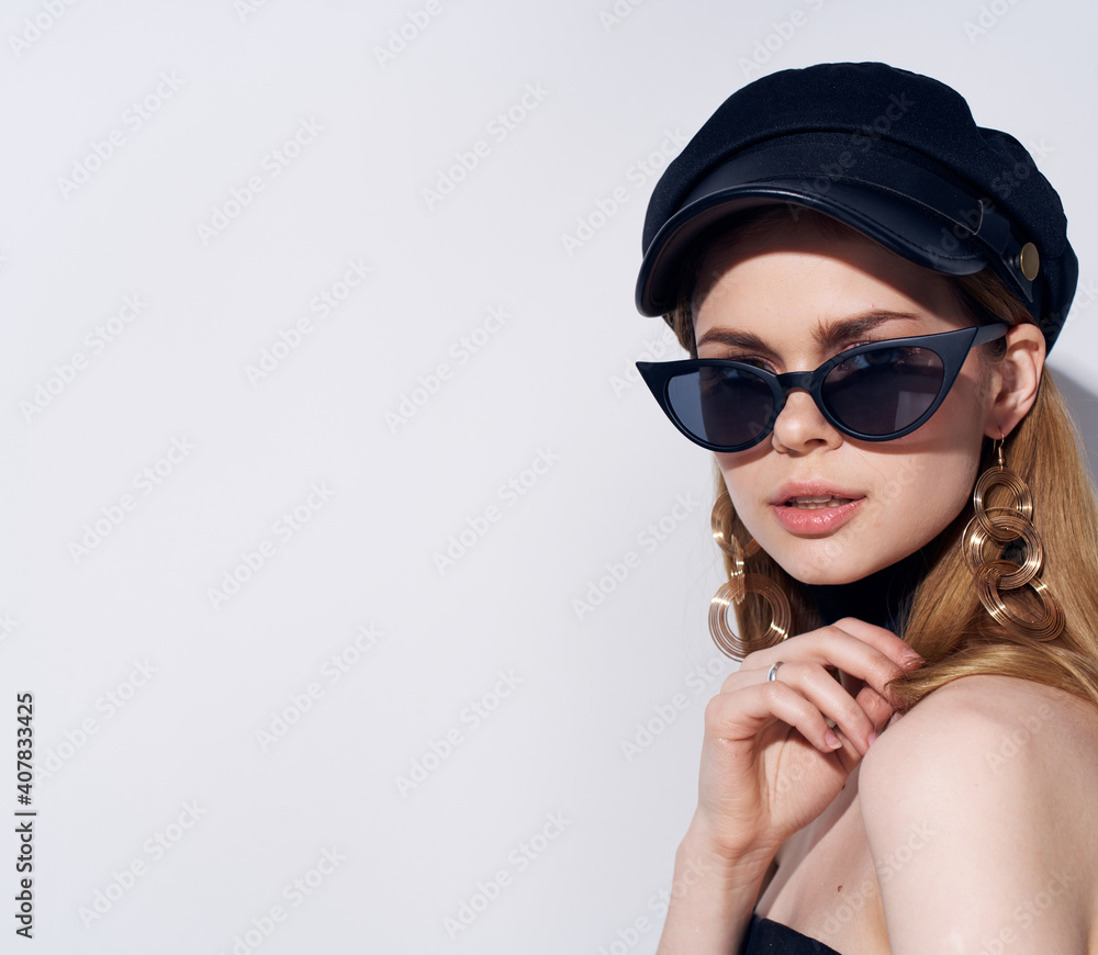 Pretty woman in black glasses bared shoulders gray background Pretty woman in black glasses bared shoulders gray background