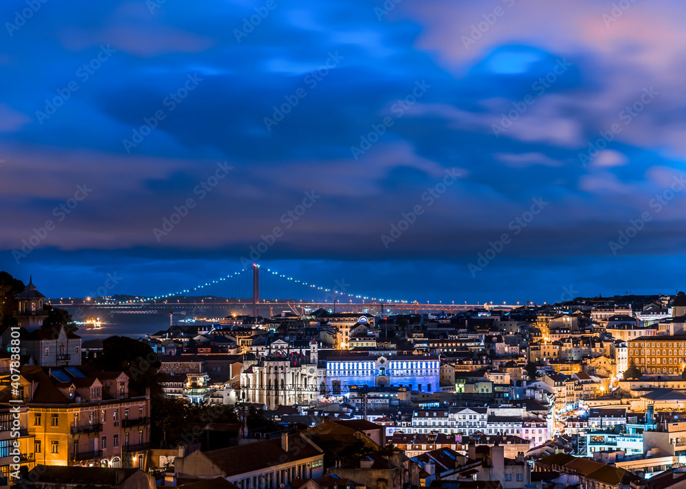 View of Lisbon city and the 25th April Bridge at night View of Lisbon city and the 25th April Bridge at night