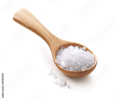 Crystal Himalayan pink salt in a wooden spoon isolated on white background