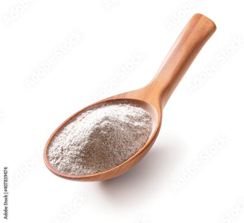 Flour in a wooden spoon isolated on white background