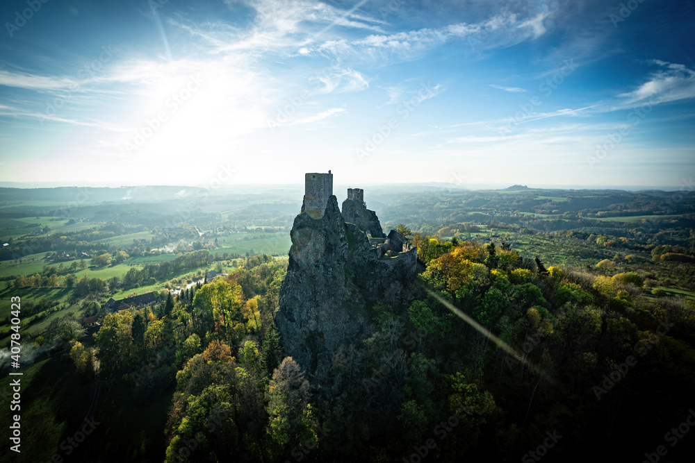 ruins of castle Trosky at autumn sunset