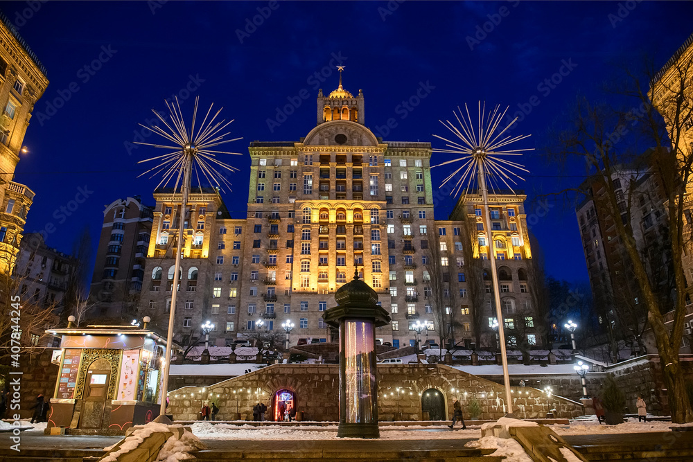 Evening view of illuminated Khreshchatyk, main street in Kyiv, Ukraine. Famous examples of Soviet architecture.