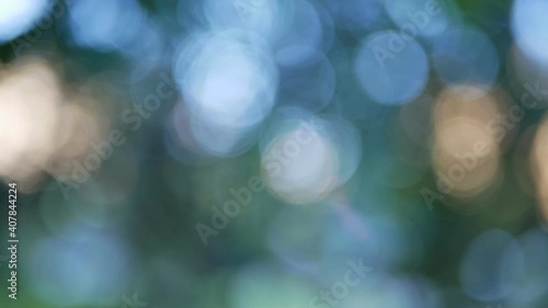 Multicolored background consisting of blue, green, golden and other colors. Abstract background, radiance and blur of light spots. photo