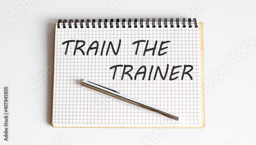 Wallpaper Mural Text on notepad Train The Trainer on white background. Business Concept Torontodigital.ca