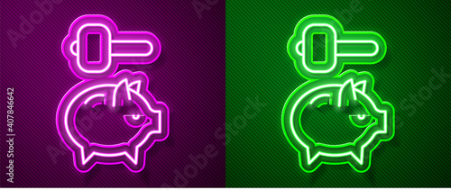 Glowing neon line Piggy bank and hammer icon isolated on purple and green background. Icon saving or accumulation of money, investment. Vector.